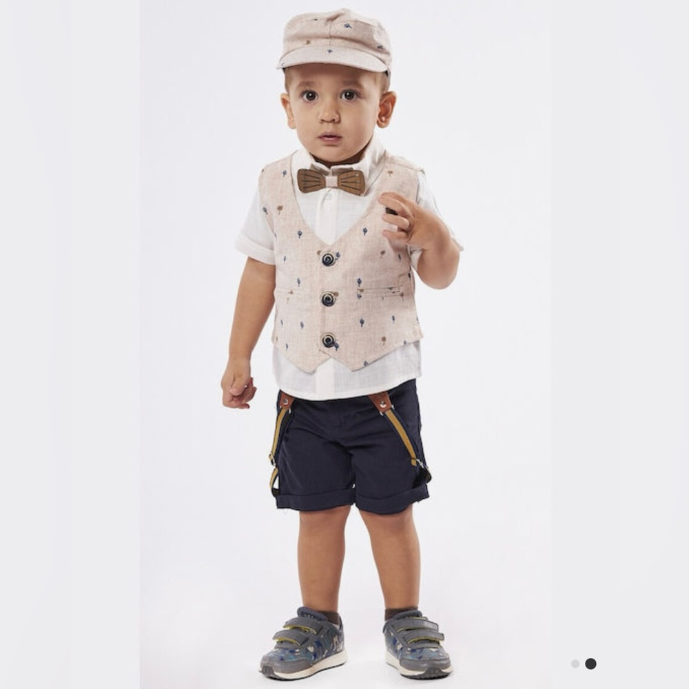 Adorable boy outfit with hat, bow, and suspenders